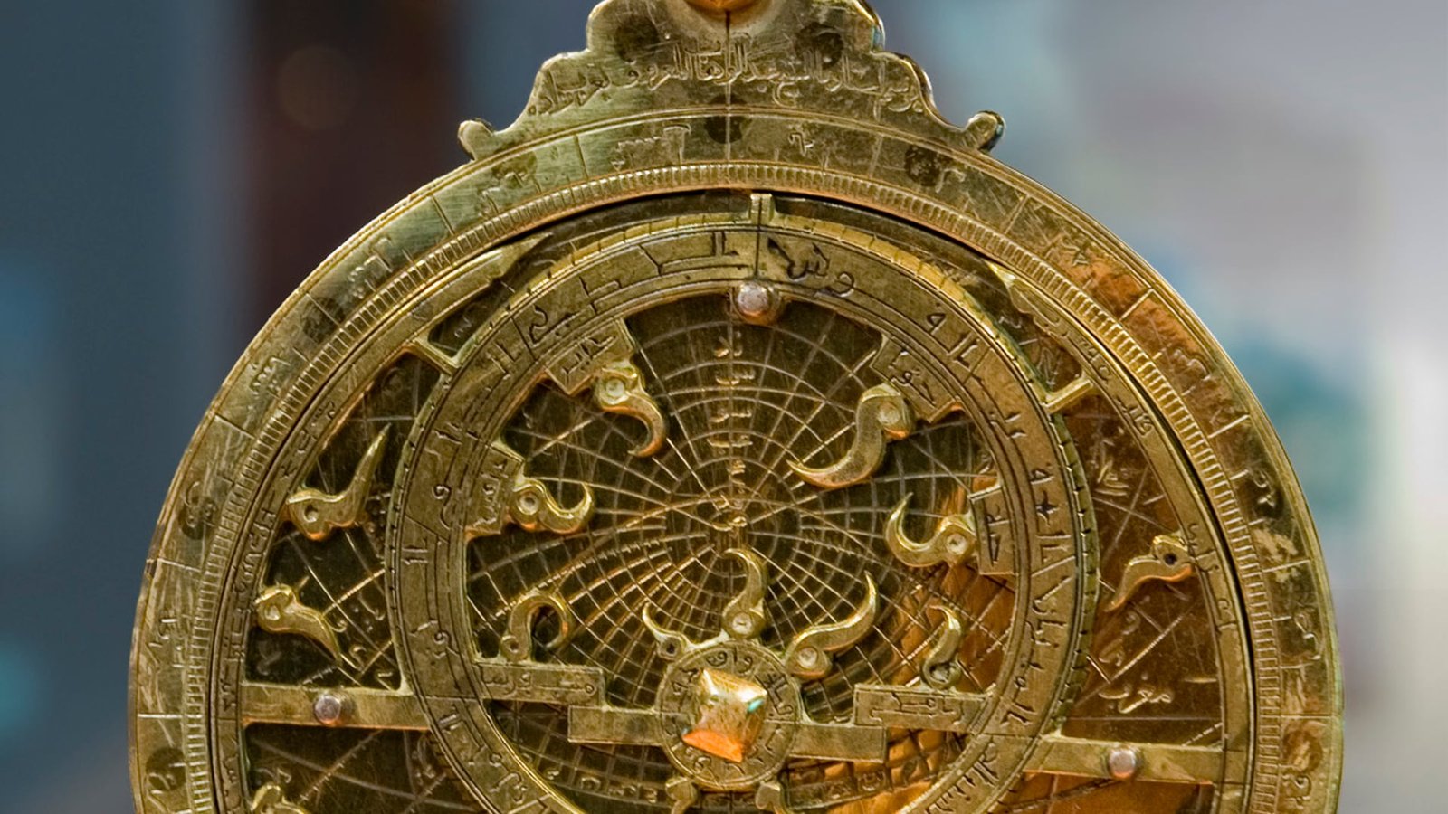 16th-century European brass planispheric astrolabe with engraved rete and stereographic ecliptic projection plates